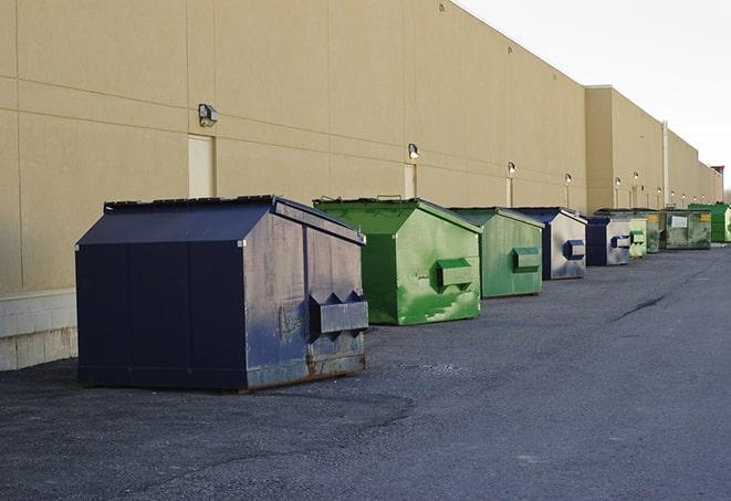 a large metal bin for waste disposal on the construction site in Enid